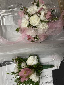 White and pink wrist corsage and boutonniere